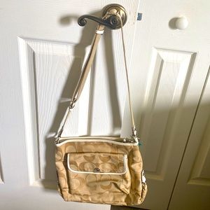 Tan coach purse with dust bag.